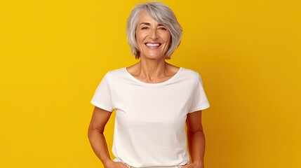 A wide shot of woman, age 60, wearing white shirt and blue pants, with lively smiling facial expression, at yellow background, design tshirt template, print presentation mock-up