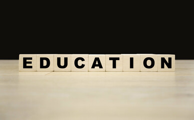 Education word written on wooden blocks. Education text for your desing, concept.