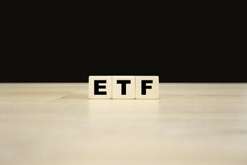 ETF word written on wooden blocks. ETF text for your desing, concept.