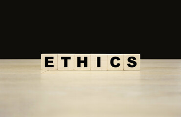 Ethics word written on wooden blocks. Ethics text for your desing, concept.
