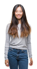 Obraz premium Young asian woman over isolated background with a happy and cool smile on face. Lucky person.