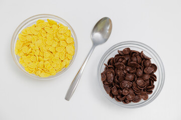 Set of glass bowls with various cereals on white