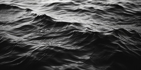 A black and white photo of a body of water. Can be used as a minimalist background or for artistic...