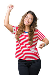 Young beautiful brunette woman wearing stripes t-shirt over isolated background Dancing happy and cheerful, smiling moving casual and confident listening to music