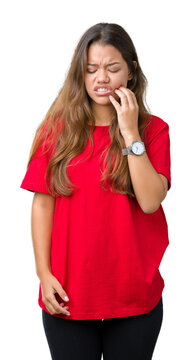 Young beautiful brunette woman wearing red t-shirt over isolated background touching mouth with hand with painful expression because of toothache or dental illness on teeth. Dentist concept.
