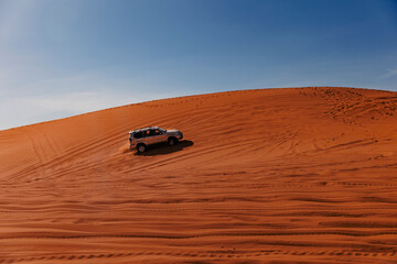 Dune riding with SUVs 4x4 vehicle at Sahara desert