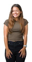 Young beautiful brunette woman over isolated background winking looking at the camera with sexy expression, cheerful and happy face.