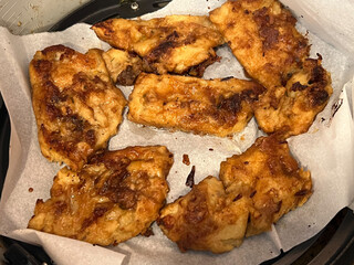 Vegan schnitzel appetizer made of seitan, gluten meat. White plate, wooden table