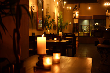 Um restaurante chique a luz de velas  - obrazy, fototapety, plakaty