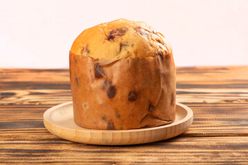 Panettone, panettone with chocolate flavors on a rustic table. Selective focus.