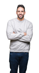 Young handsome man wearing sweatshirt over isolated background happy face smiling with crossed arms looking at the camera. Positive person.