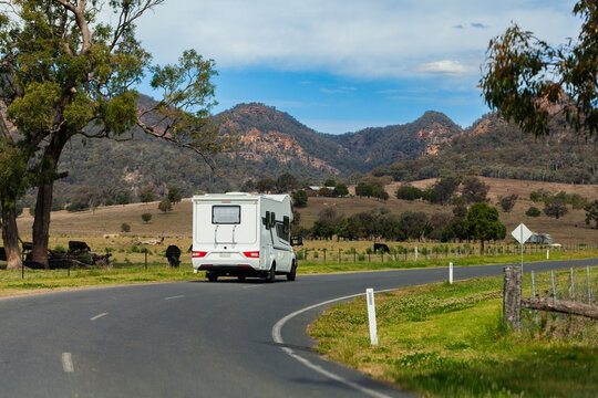 Campervan travelling on road in rural NSW australia