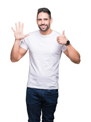 Young man wearing casual white t-shirt over isolated background showing and pointing up with fingers number six while smiling confident and happy.