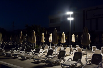 Early predawn near an empty hotel pool.,