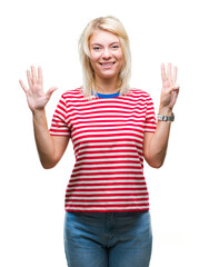 Fototapeta na wymiar Young beautiful blonde woman over isolated background showing and pointing up with fingers number eight while smiling confident and happy.