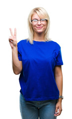 Young beautiful blonde woman wearing glasses over isolated background showing and pointing up with fingers number two while smiling confident and happy.
