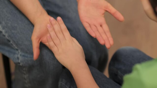 The silent communication of care and comfort from an adult to a child, an essential part of emotional development and trust-building.