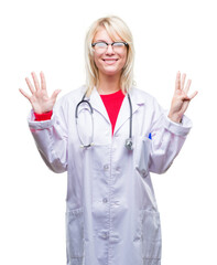 Young beautiful blonde doctor woman wearing medical uniform over isolated background showing and pointing up with fingers number nine while smiling confident and happy.