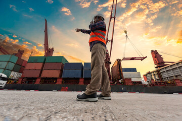 Quality Control Officer inspecting warehouses at containers yard for international shipping businesses © tonjung