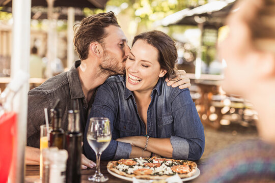 Romantic couple having a happy time at an outdoor restaurant.