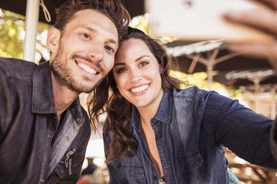 Romantic couple having a happy time at an outdoor restaurant.