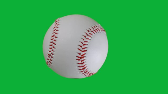 close up of baseball spinning on the green screen background, Chroma key