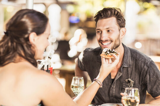 Romantic couple having a happy time at an outdoor restaurant.