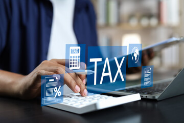 Tax and Vat concept. Government, state taxes concept. Businesman using tablet and laptop to complete Individual income tax return form online for tax payment. Data analysis, financial research.