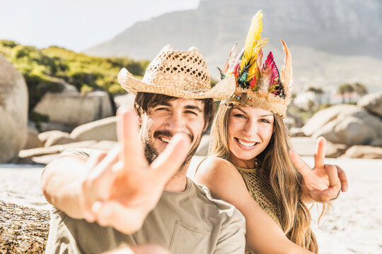 Romantic Boho couple hanging out on the beach