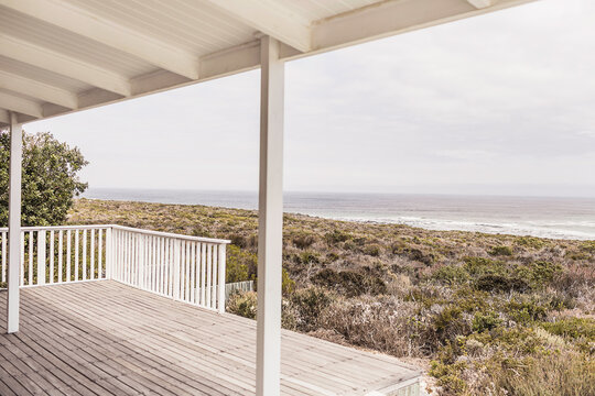 Interior and outdoor view of beach house in shabby chic look