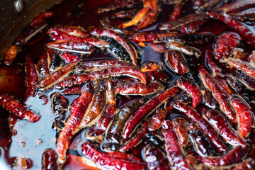 Dried peppers and put them into the pot of spicy soup.