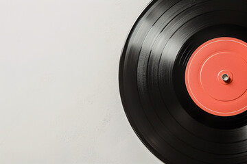 Vinyl record with bright orange center on white background
