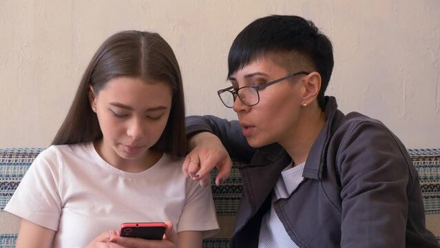 Grandniece Teaching Aunt Smartphone Apps