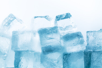 ice cubes isolated white background,Natural crystal clear melting ice cubes on white reflective surface background.