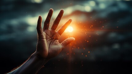 A hand reaching up to a glowing light. Hand covering a light flare.