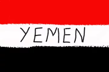 Foto op Plexiglas The flag of Yemen painted with a brush in a graphics program. © Szymon Bartosz