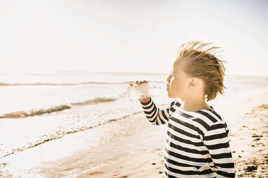 Young boy having fun playing on the beach
