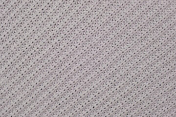 Soft Knitted Woolen Detailed Texture. Natural Fabric Closeup Knit Pattern. Gray Knitwear, Warm Cashmere Surface. Rotation, Macro. Cozy Textile Background. Clothes Production. Melange Yarn. 4K Shot