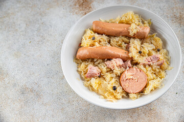 cabbage sauerkraut with garnish, meat, sausage tasty fresh eating cooking appetizer meal food snack on the table copy space food background rustic top view