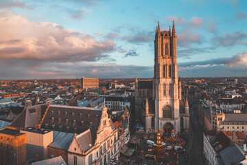 Watching the sunset over Ghent from the historic tower in the city centre. Romantic colours in the...