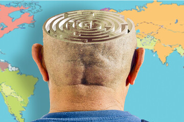 A maze on a man's head. A world map is shown in the background.