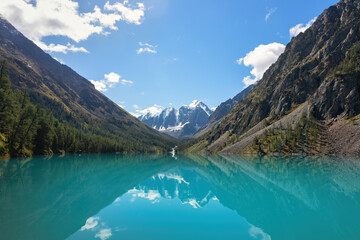 Naklejka na ściany i meble Turquoise Lake with mountain views