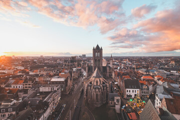 Watching the sunset over Ghent from the historic tower in the city centre. Romantic colours in the...