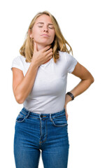 Fototapeta premium Beautiful young woman wearing casual white t-shirt over isolated background Touching painful neck, sore throat for flu, clod and infection