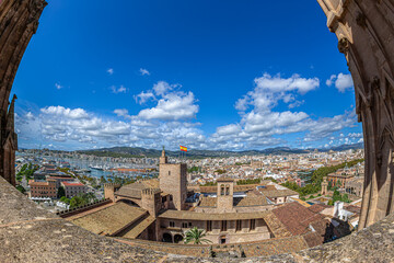 View from the terrace of the medieval Cathedral of Santa Maria of Palma of the roof of the Royal Palace of La Almudaina, Palma de Mallorca, Spain - 711646360