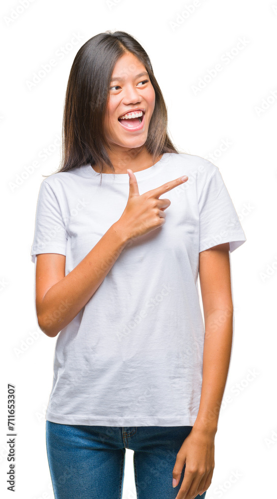 Sticker young asian woman over isolated background cheerful with a smile of face pointing with hand and fing