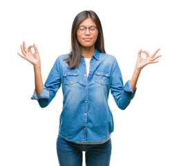Young asian woman wearing glasses over isolated background relax and smiling with eyes closed doing...