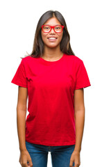 Obraz premium Young asian woman wearing glasses over isolated background with a happy and cool smile on face. Lucky person.