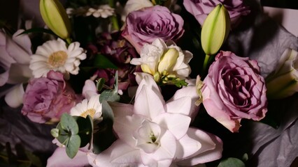 Rotating spring summer floral pastel arrangement in the background close up. Celebrating Mother's Day, International Women's Day March 8. Flowers gardenia, rose, Lilia, eucalyptus