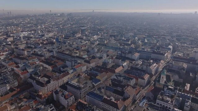 Aerial panoramic view of metropolis in morning. Blocks oof multistorey apartment buildings in residential urban borough. Vienna, Austria